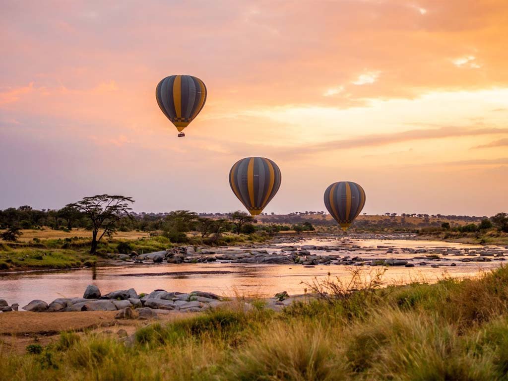 Hot air balloon safari over Serengeti Tanzania at sunrise during the Great Migration